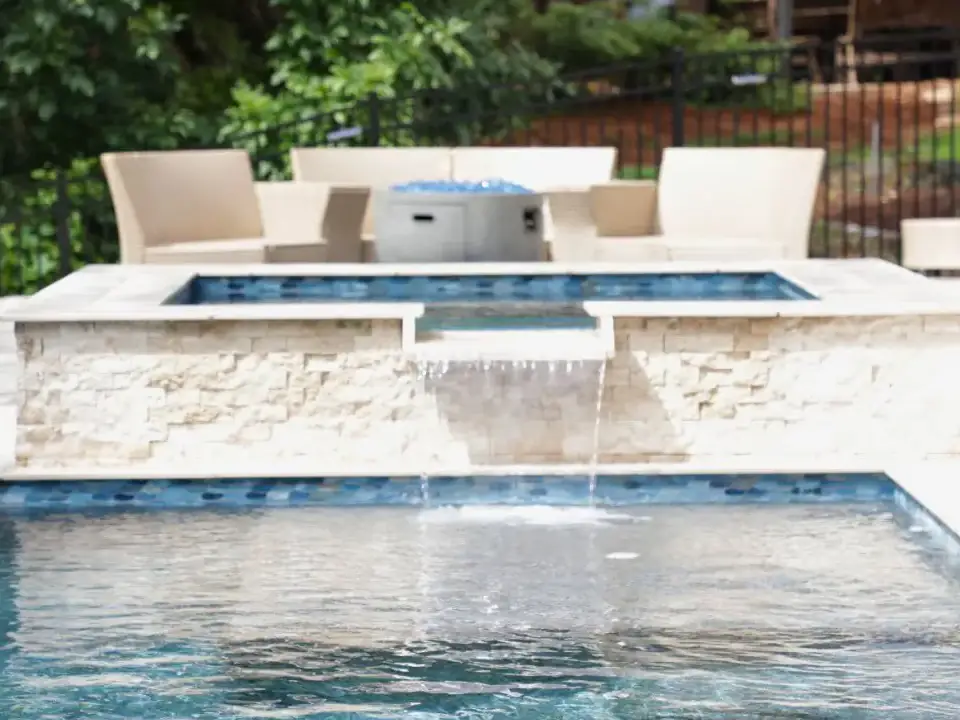 RutherfordMade raised spa spillover connected to a custom pool